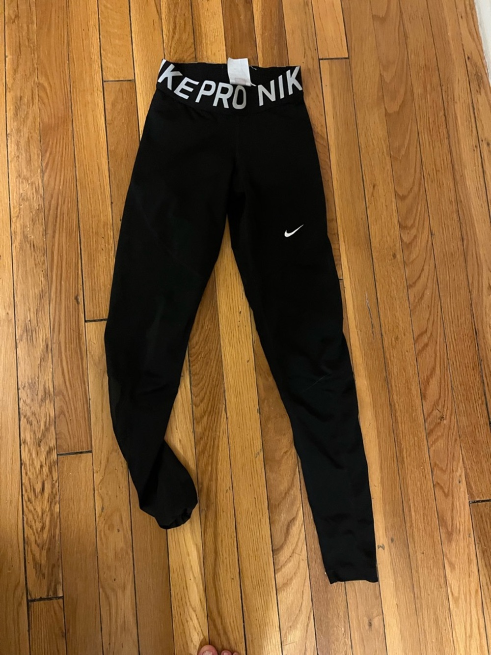 Nike women’s Black Leggings with White Swoosh and Logo Waistband